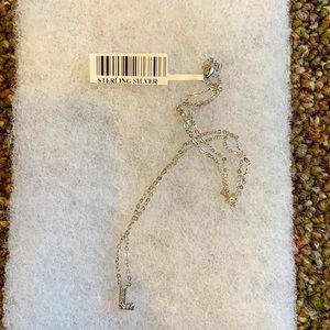 16 inch sterling silver necklace- letter “L” has diamonds in it.